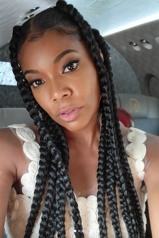 Image may contain Hair Gabrielle Union Face Human Person Clothing Apparel and Scarf